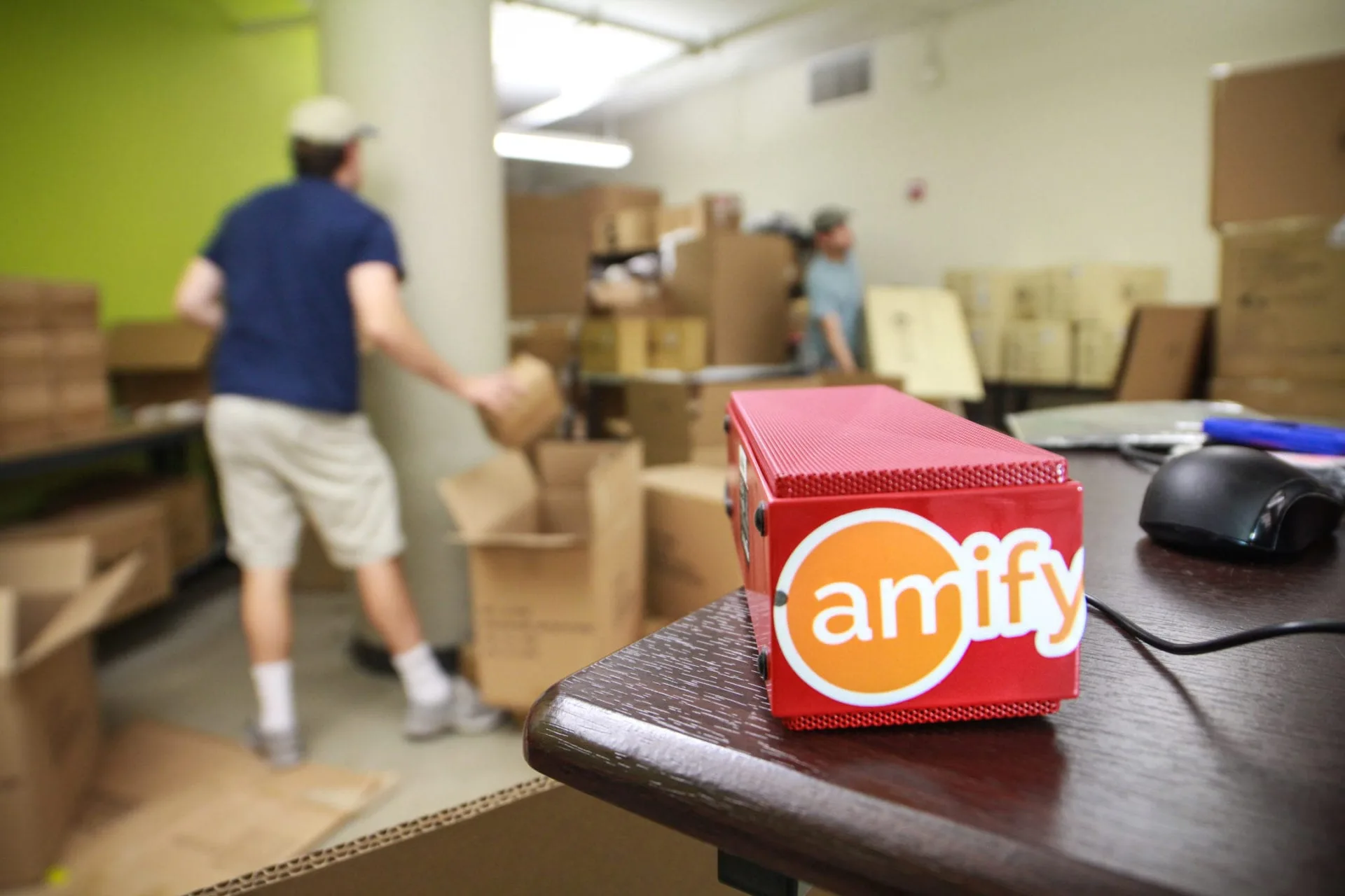 red amify box on wooden table